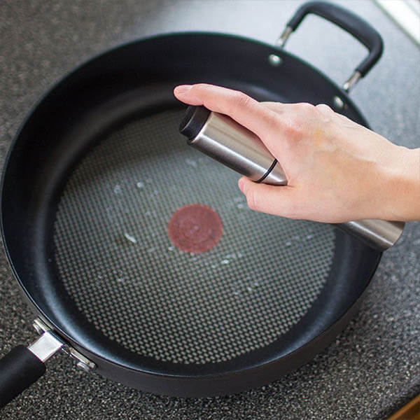 Oil spray in a stainless steel bottle
